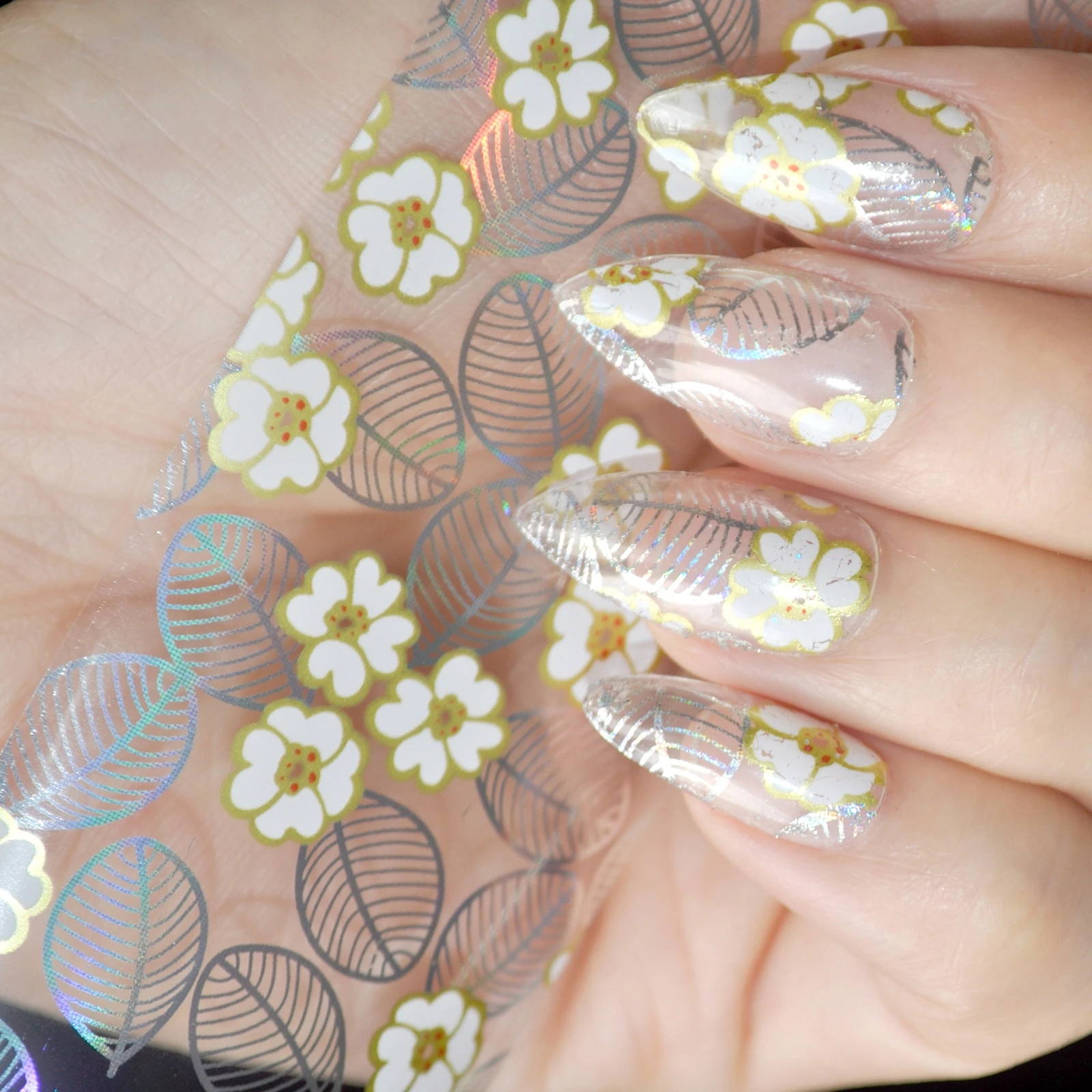 One Roll In Clear Jar Nail Art Glue Transfer Foil White Flower One Roll In Clear Jar Nail Art Glue Transfer Foil White Flower Design Decoration Sticker Laser Silver Leaf Pattern Stickers Decals From Beauty