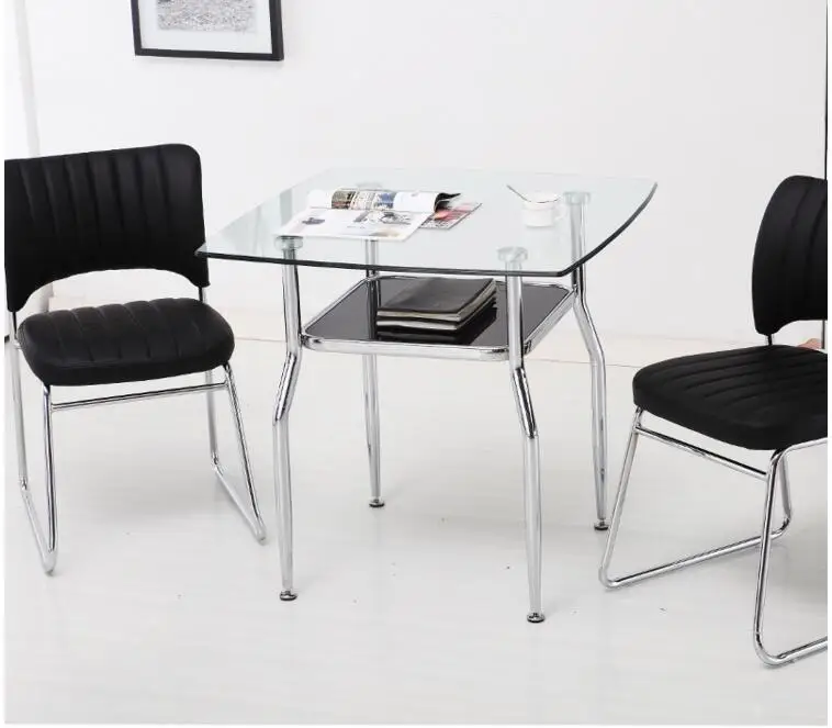 Steel glass small square table... Rest the table.