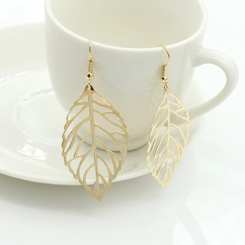 HIYONG Pendientes Mujer Горячая Мода оптом полые металлические листья Висячие длинное