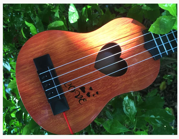 Музыкальная игрушка пластиковая укулеле для начинающих детей