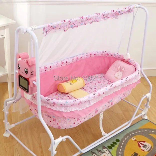 pink swinging crib