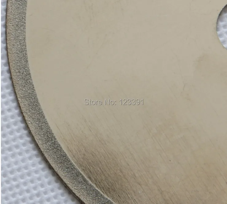 

Free shipping of super quality diamond thin kerf jade agate cutting silent cutting disc diameter 100mm arbor 12.5mm thick 0.7mm