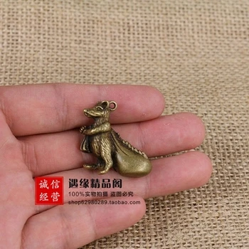 

Antique old brass rat pulling money bag Pendant
