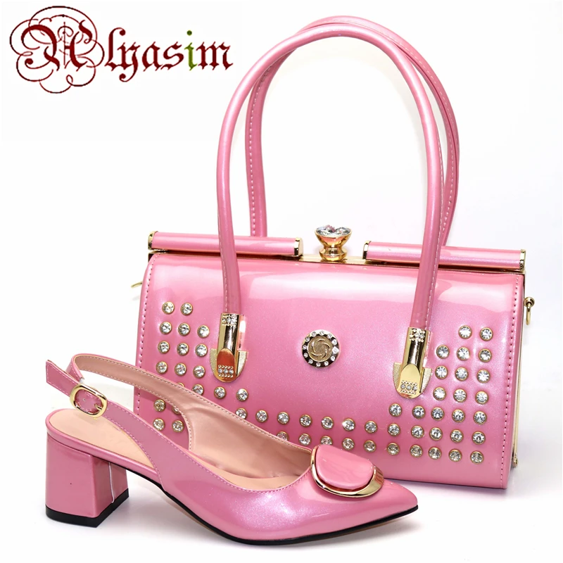 pink clutch bag and matching shoes