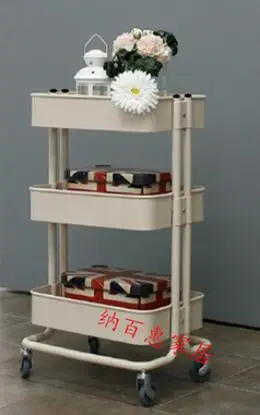 Carts. Multilayer metal receive a shelf in the kitchen.