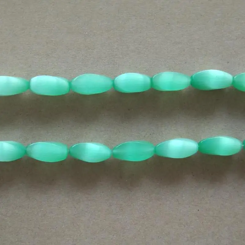 

About 9x21mm twisted cats eye glass loose beads,19 pieces per lot,About 1.2 mm in hole for jewelry use,promotion price!