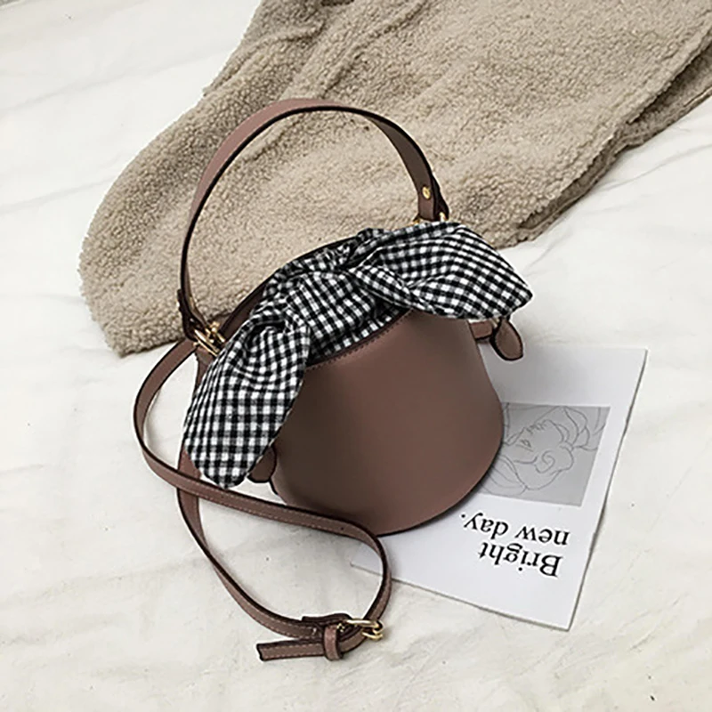 النساء بو الجلود حقيبة يد الشهيرة مصمم جديد الأزياء دلو حقيبة Crossbody حقيبة عبر القوس النساء حقيبة كتف النساء بو الجلود حقيبة يد الشهيرة مصمم جديد الأزياء دلو حقيبة Crossbody حقيبة عبر القوس النساء حقيبة كتف