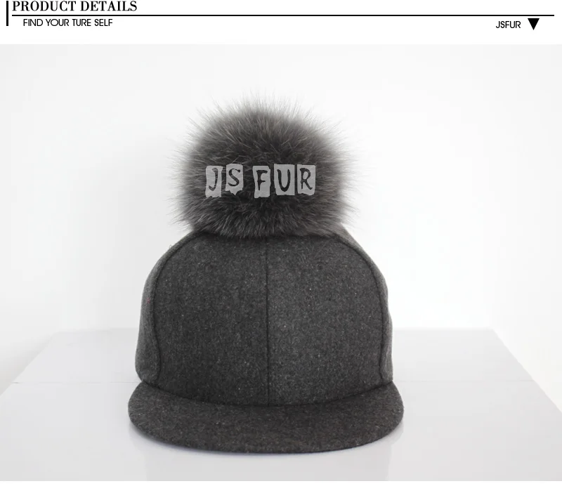 baseball cap with fur ball on top