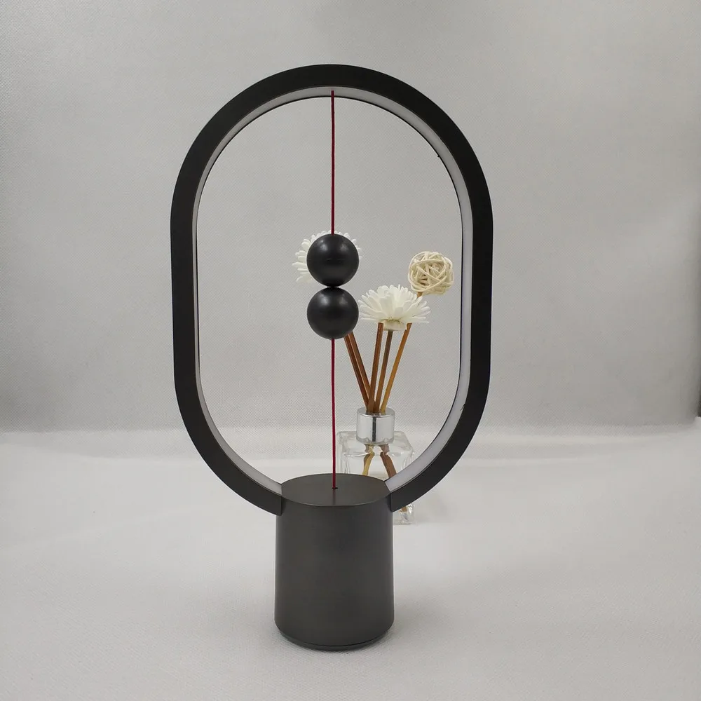 

2019 Newest USB Power Ellipse Magnetic Mid-air Switch Warm White Night Light Mini Heng Balance LED Table Lamp Office Home Decor