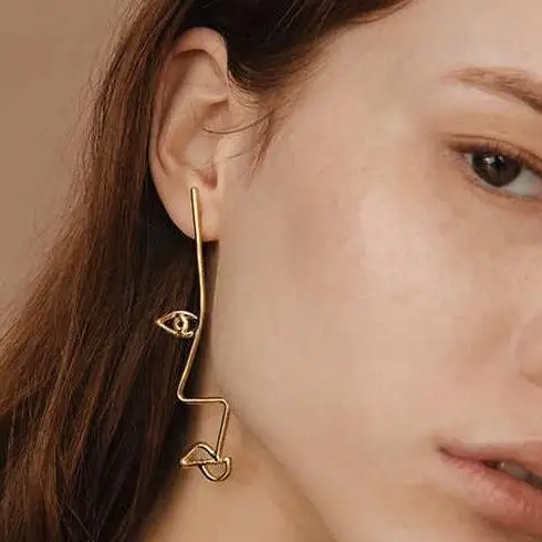 

Free Shipping Fashion Personality Hand Made Metal Face Contour Twisted Hollow Asymmetry Stud Earrings Jewelry For Women