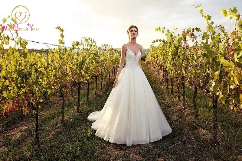

2019 Wedding Dress Garden Spaghetti Straps Sexy Tulle Appliques Top With Beading V-neck Sweep Train Buttons Covered Back Gown