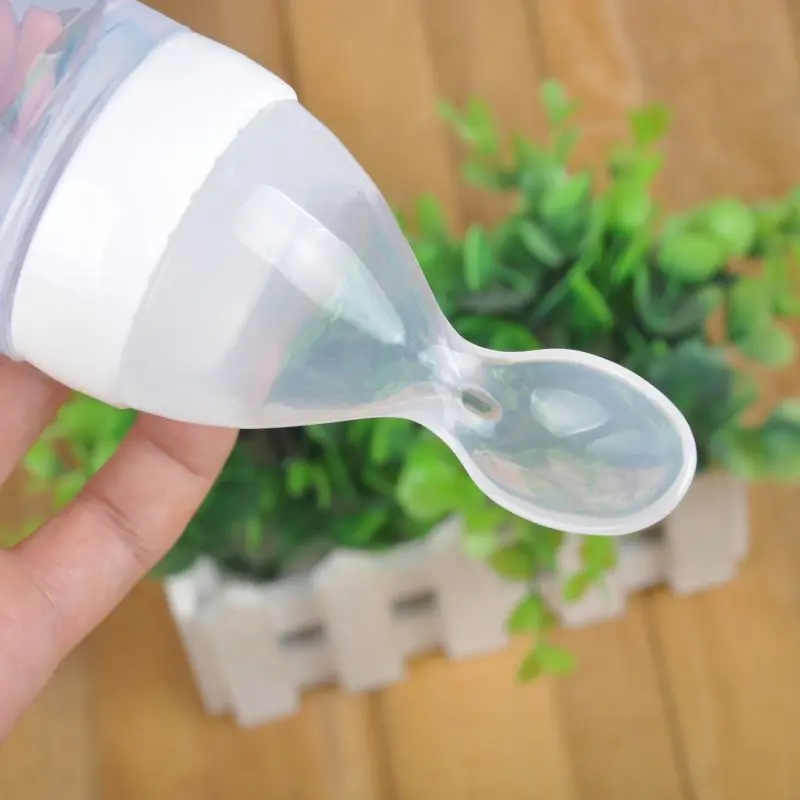 Hot Newborn Baby Squeezing Feeding Bottle Silicone Training Rice Spoon Infant Cereal Food Supplement Feeder Safe