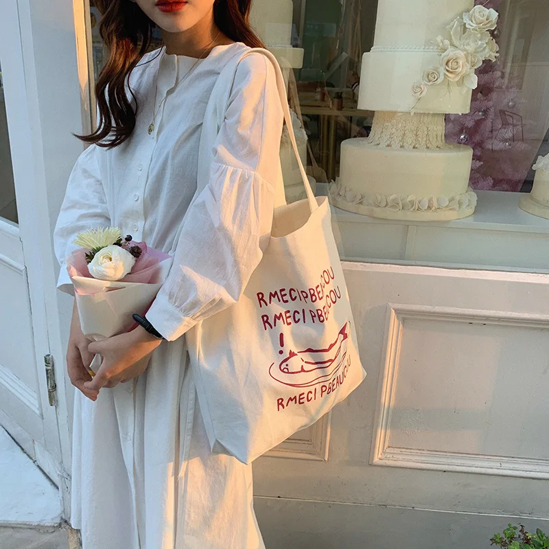 

Korean version of the niche design casual canvas bag student wild shoulder bag portable green shopping bag female