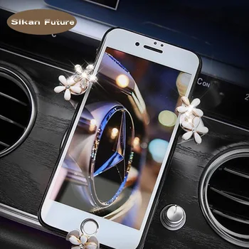 

Car lady mobile phone bracket gravity induction small chrysanthemum air outlet mobile phone chrysanthemum gravity mobile support