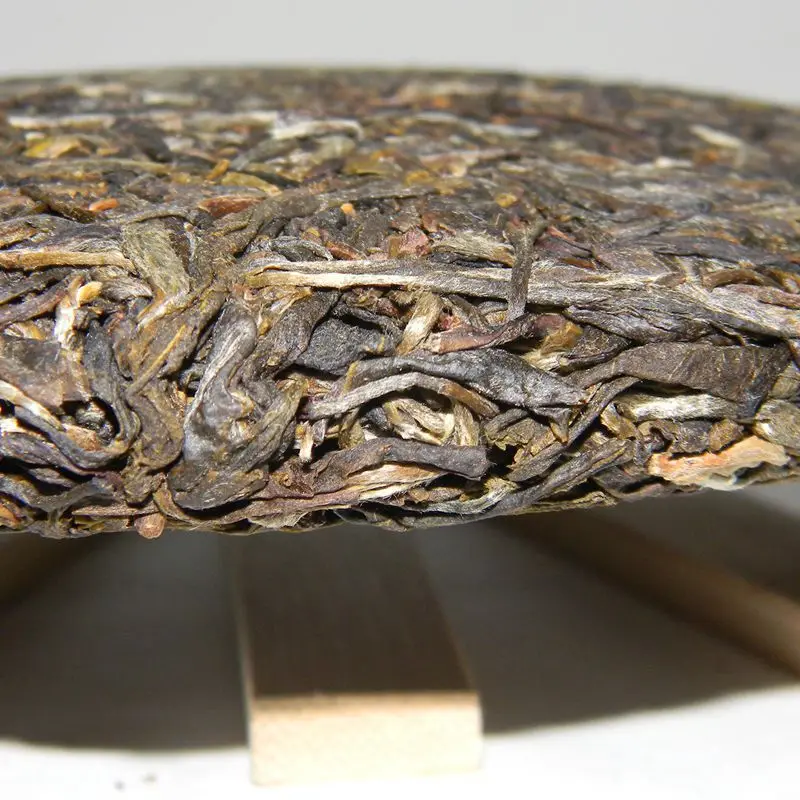 

Wholesale 2014 Pu'er tea raw tea trees Wuliangshan pure stone material 357 grams of pure repression Seven tea cakes