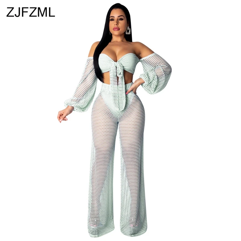 

Summer Beach Two Piece Matching Sets Women Fishnet Bow Tie Short Top And Perspective Boot Cut Pants Sexy Club Tracksuits Outfits