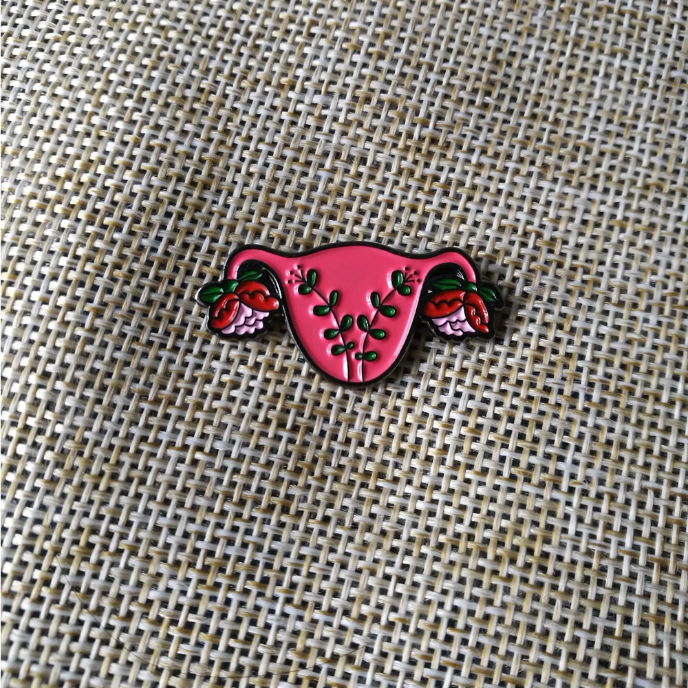 

pink metal badge