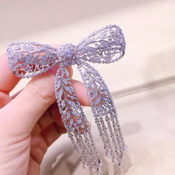 

Qi Xuan_New S925 Sterling Silver Bowknot Tassel Brooch Brooch Pin Korea Luxury Atmosphere Brooch High-End Women