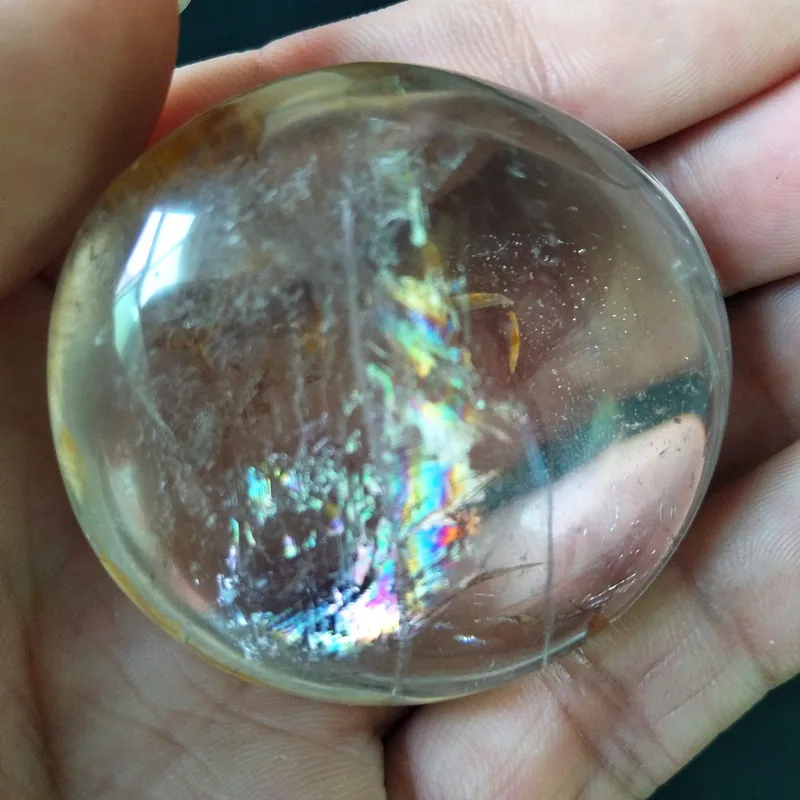 A Natural quartz crystal palm stone with rainbow yoga practice plaything chakra healing crystals