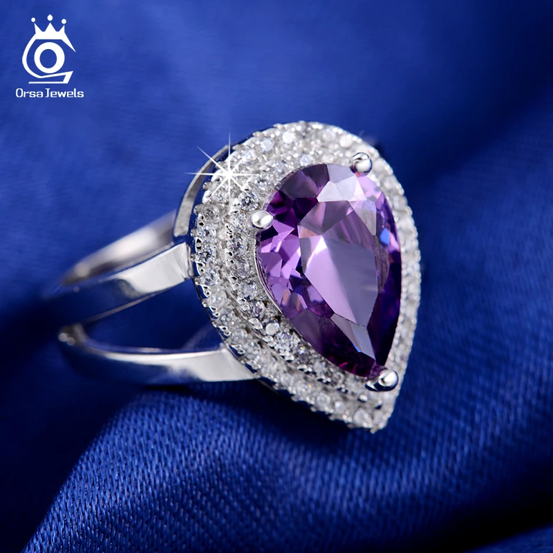 ORSA JEWELS Big Water Drop 6 ct Zircon Ring 3 Prong Setting with Micro Paved CZ Stone Around Trendy Party Rings for Women OR36
