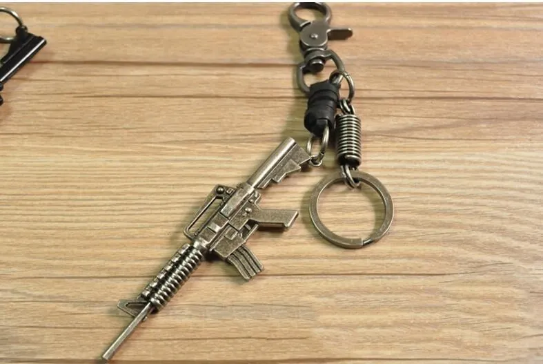 hot Classic Genuine Leather Revolver Pistol Weapon fashion Model Keychain Key Rings New Mini Gun key Chain For Men Jewelry Gift hot Classic Genuine Leather Revolver Pistol Weapon fashion Model Keychain Key Rings New Mini Gun key Chain For Men Jewelry Gift