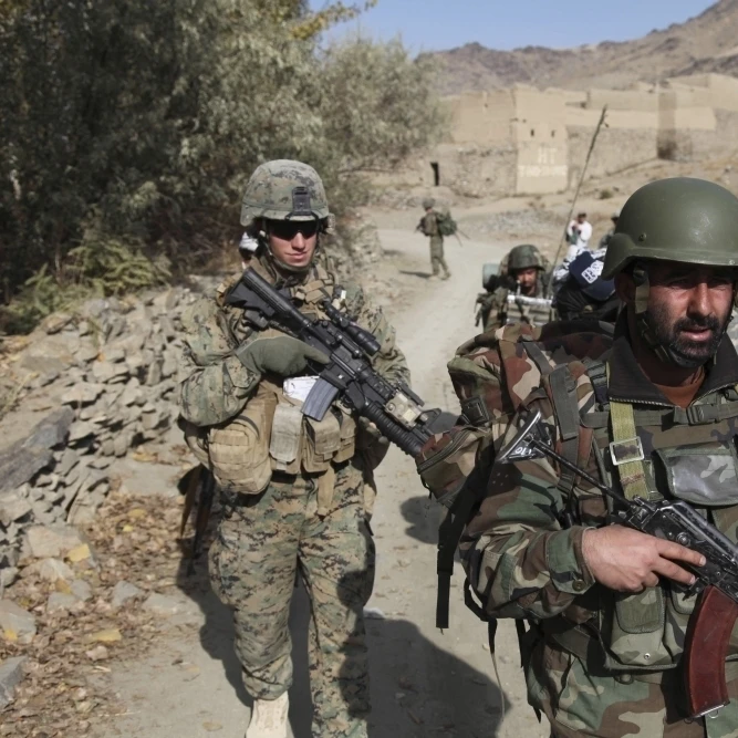Soldiers patrol the Depak Valley in Afghanistan Poster Print (17 x 11)