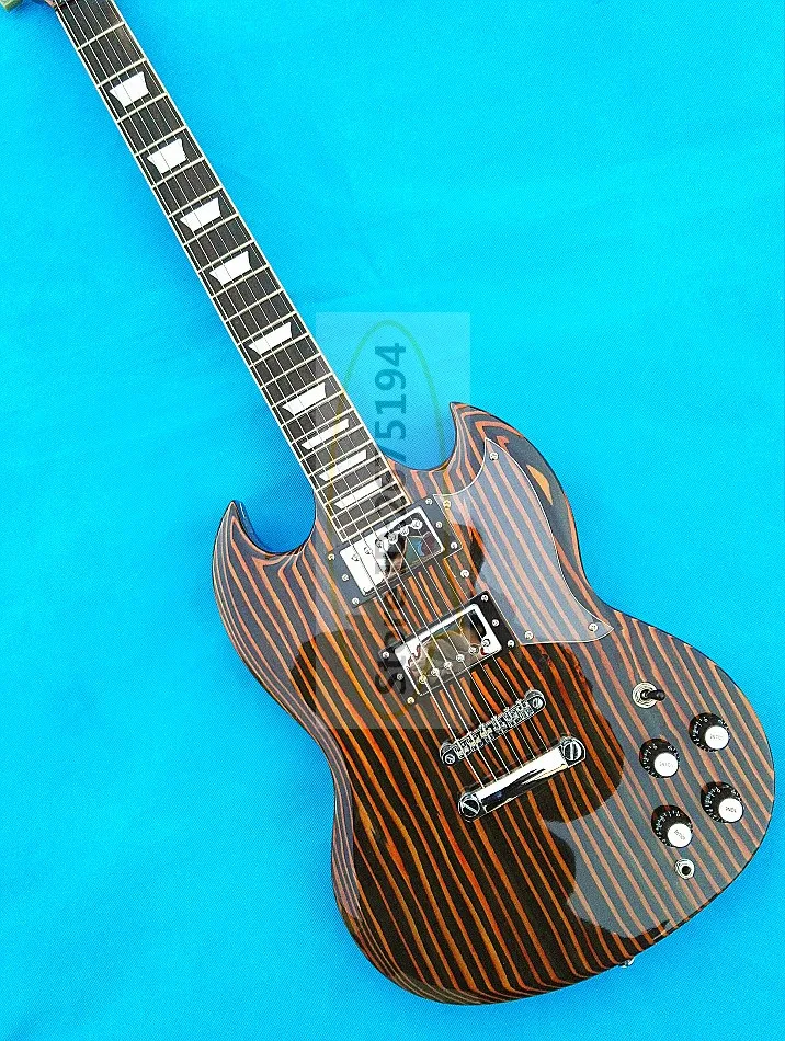 Free shipping.Zebra wood one SG electric guitar. Super tone, ultra low