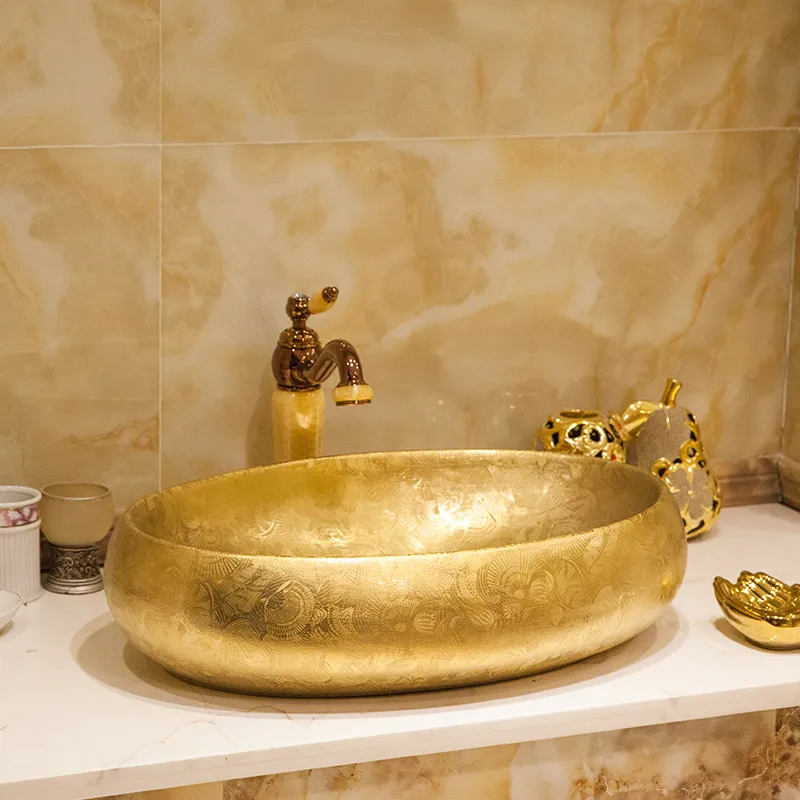 

Artistic Procelain wash basin sink ceramic basin sink Ceramic Lavabo Embossed bathroom ceramic sinks Golden/Silver oval