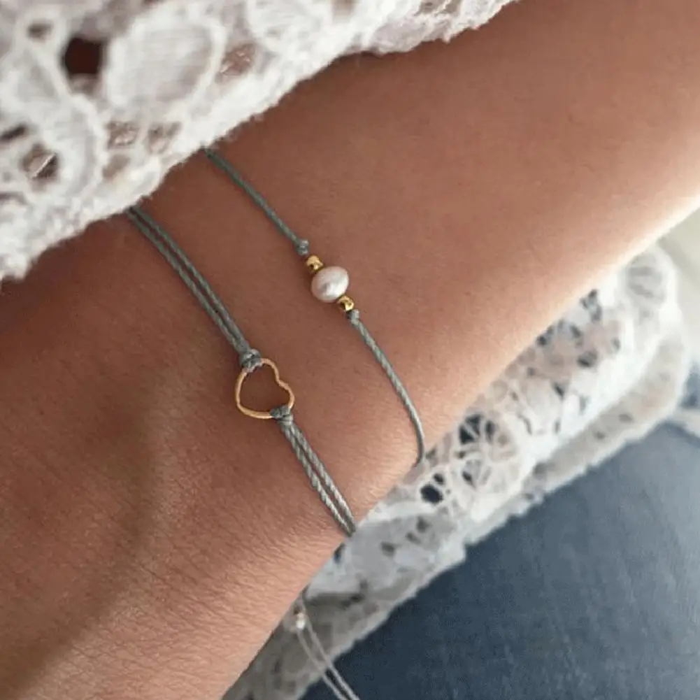 

Women 2Pcs/Set Double Layer Braided Rope Imitation Pearl Hollow Heart Bracelet