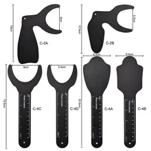 Tableau de contraste de Photo d'image de fond noir, plaque de joue orale avec marque d'échelle, outils de dentiste autoclavables 6 pièces