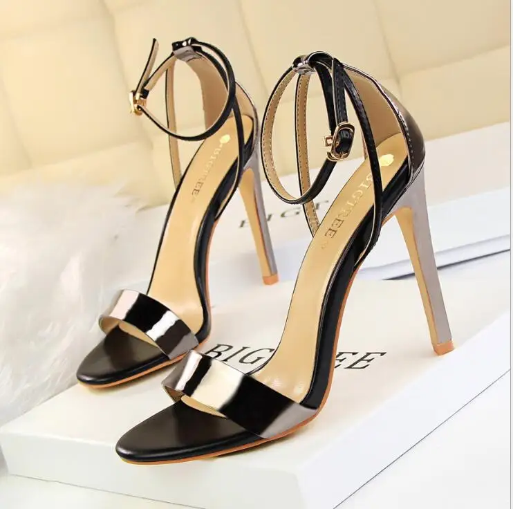 

European and American sexy women's shoes with super high-heeled hollow color matching word with open toe hollow sandals