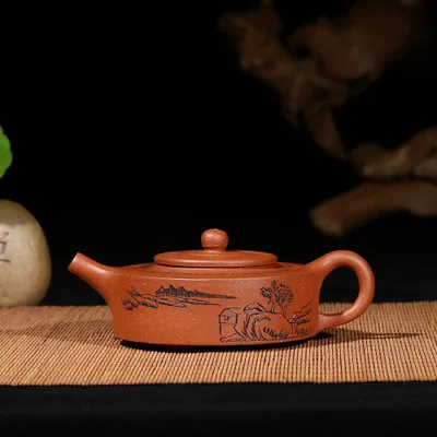 

2018 new style 100ml Yixing zisha tea pot handmade purple clay pot original sloping mud circular lettering landscape kettle