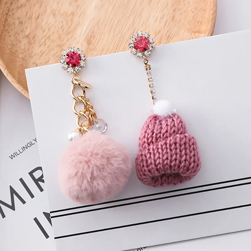 

Korean Fashion Jewelry Cute Asymetric Woolen Hats Shaped Pompom Charm Earrings With Red Crystal Creative Drop Earrings for Women
