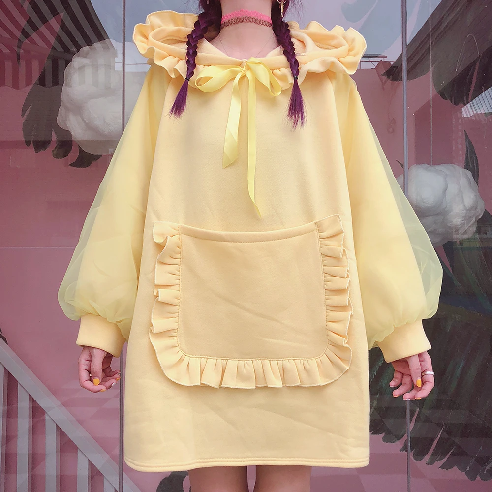 

Girl with a fur long yellow a loose lace hoodies sweatshirt