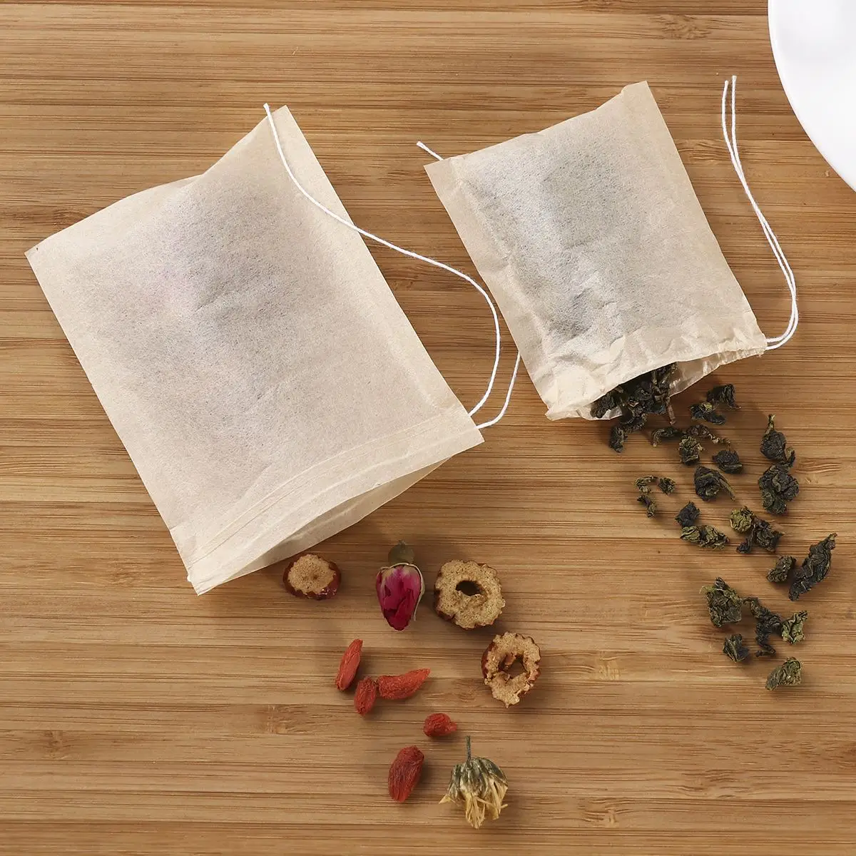 200pcs Non-Woven Fabrics Teabags Drawstring Tea Bag Filter Paper Empty Tea Pouch Bags for Loose Leaf Tea Powder Herbs Wholeasle