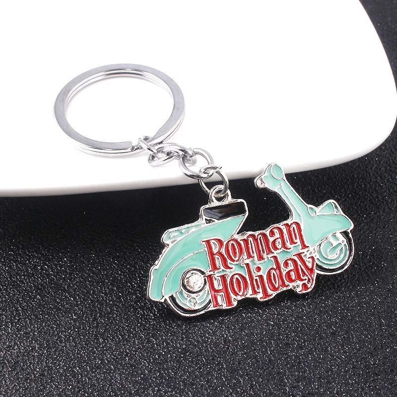 

Movies Roman Holiday Keychains Vintage Audrey Hepburn Blue Color Motorcycle Pendant For Man Woman Jewelry