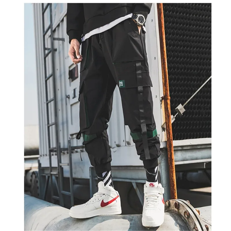 

Male Patchwork Overalls Japanese Streetwear Joggers Pants Male Designer Harem Pants Male Unique Hip Hop Belt Cargo Pants