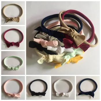 

Wholesale 50pcs Fashion Cute Bow Newborn Super Soft Nylon Hairbands Kawaii Solid Nylon Bowknot Girls Headbands Headwear