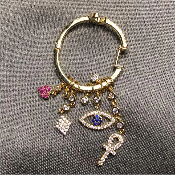 A piece elegant dangle tassel earring with various shaped lucky charm evil eye heart cross cz drop luxury fashion earring design
