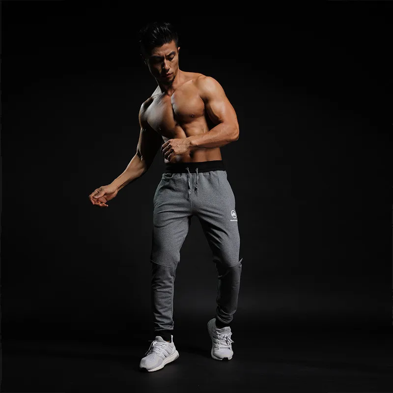 2019 Fashion Mens Pants New Solid Color Casual Soft Elastic Cotton Skinny Sweatpants Bodybuilding Pencil Trousers Gyms Clothing