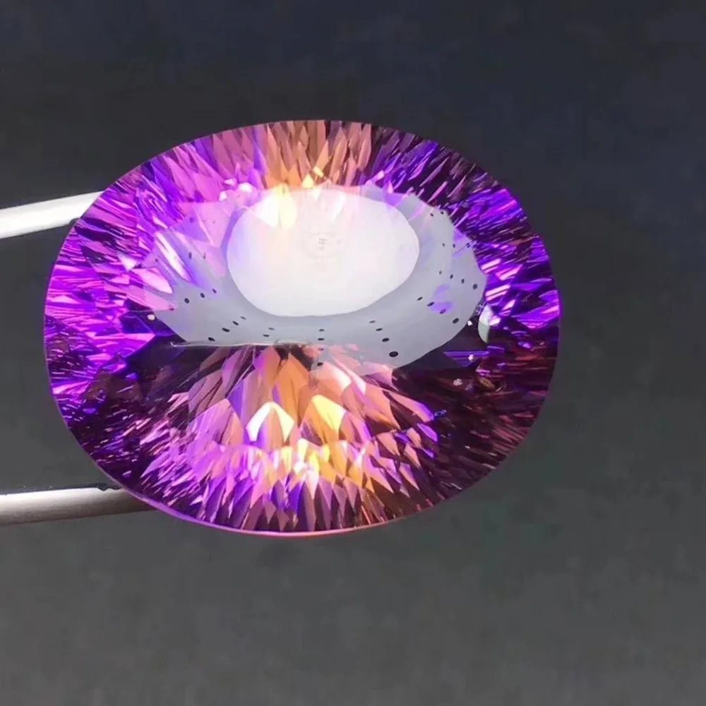 

Brazil natural Ametrine Jewellery ,Superb cutting and dazzling colors,Weight: 82.2ct Specifications: 31.6 x 25.2 x 17.8mm