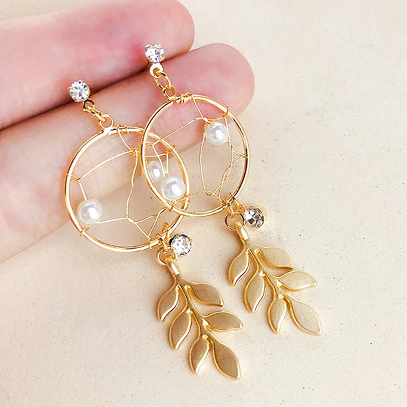 

Fashion Rhinestone Dreamcatcher Earrings Matte Golden Leaves Fringed Hollow Pearl Woven Earrings For Women FSPES263
