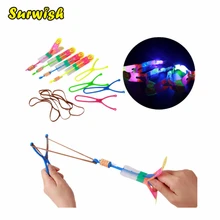 Surwish Large LED Light Slingshot Elastic Arrow Rocket Helicopter Flying Toy Party Fun Gift – Color Random