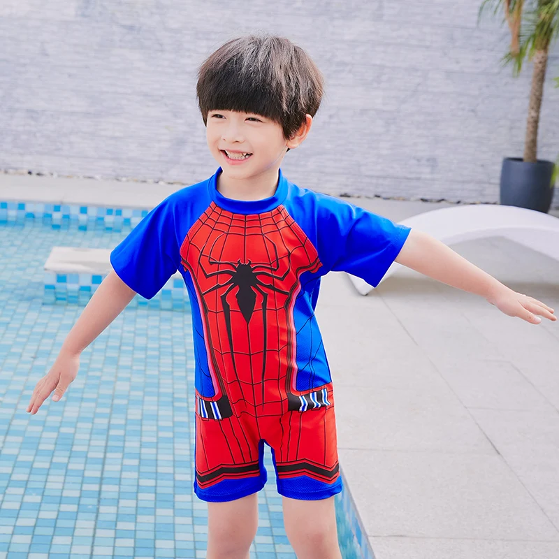 boy wearing one piece swimsuit