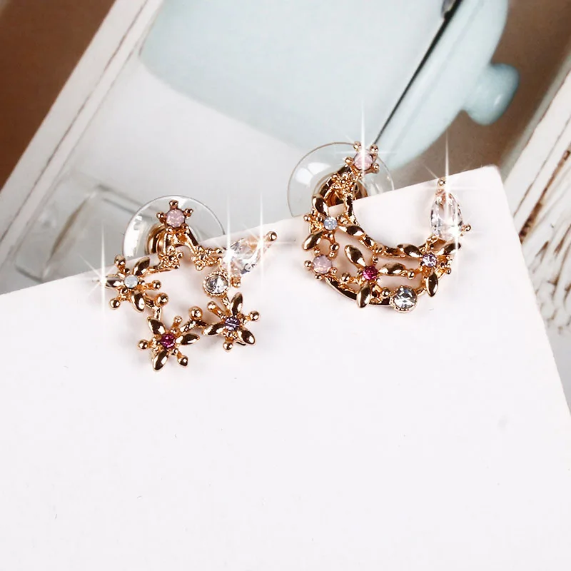 

New Korean version of the stars and moons asymmetrical simple and compact temperament earrings niche retro earrings