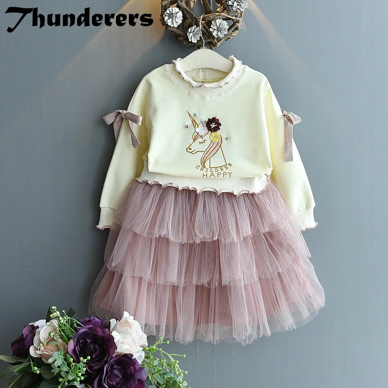 

Girls clothing suit spring and autumn girls cute pony unicorn fungus collar sweater + cake pettiskirt two-piece suit
