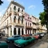 Old cars parked outside buildings  Havana  Cuba Poster Print (38 x 12)
