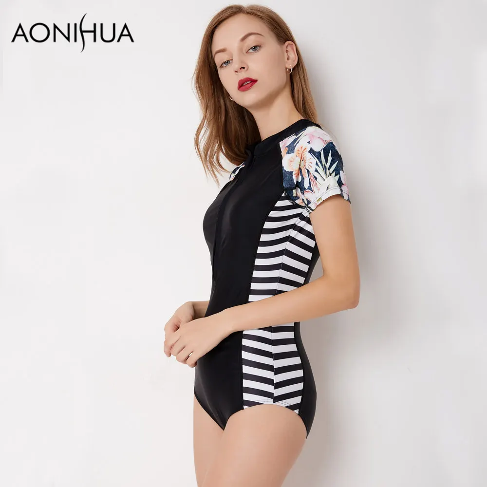 AONIHUA الأسود ملابس السباحة 2018 ضئيلة مخطط واحد قطعة بِدل السباحة النساء قصيرة الأكمام الرجعية الأزهار الشاطئ ارتداء تصفح ملابس السباحة XXL