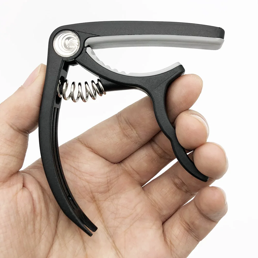 SLOZZ Guitarra de plástico de Capo 6 cuerdas eléctrica acústica Guitarra Bass Ukulele de abrazadera Capotraste Violao Accesorios SLOZZ Guitarra de plástico de Capo 6 cuerdas eléctrica acústica Guitarra Bass Ukulele de abrazadera Capotraste Violao Accesorios