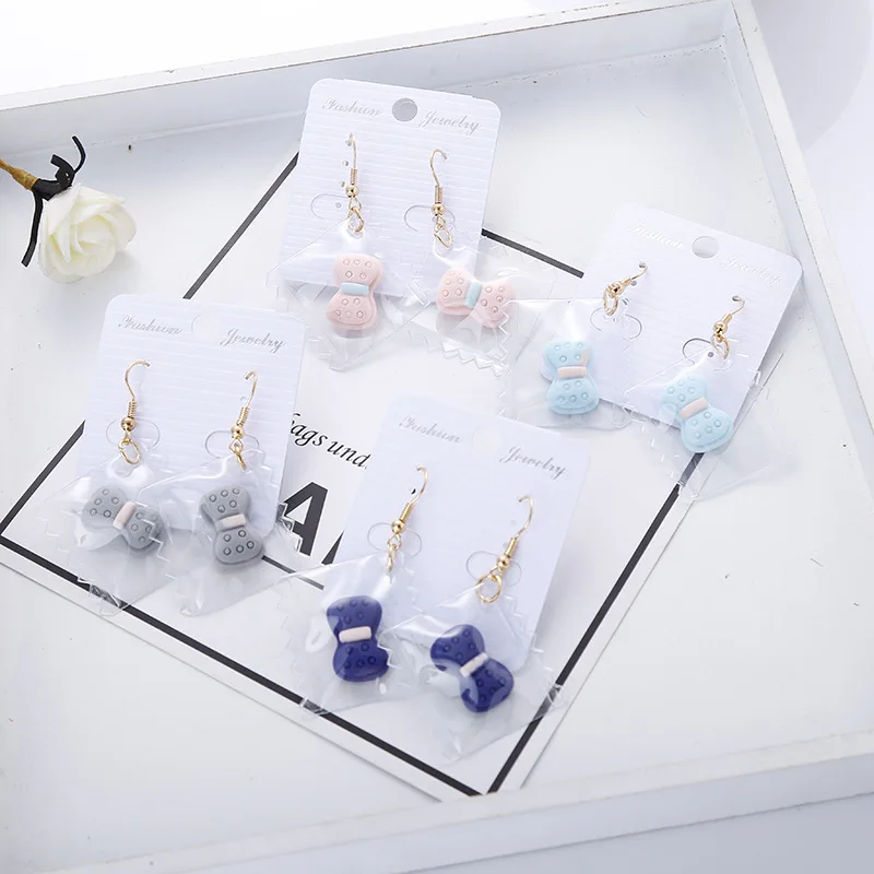 

Korean Transparent Candy Blue Pink Gray Dog Bones Long Dangle Earrings Big Drop Earrings for Women Jewelry Fashion